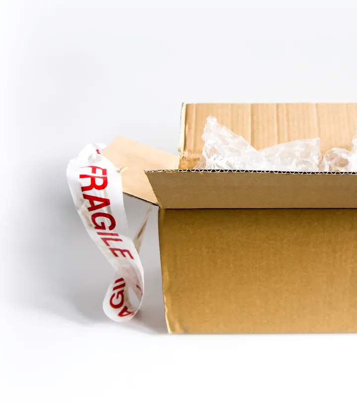 Open corrugated carton with protective packing