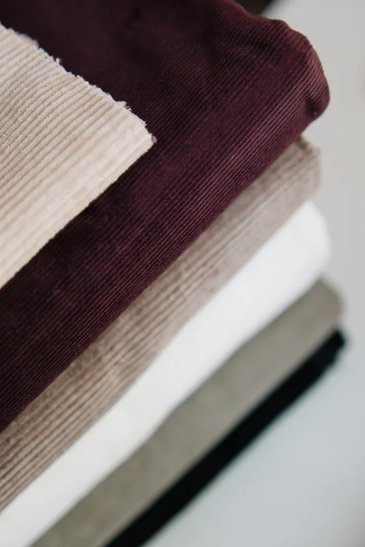 Stack of corduroy fabrics in coordinated colours