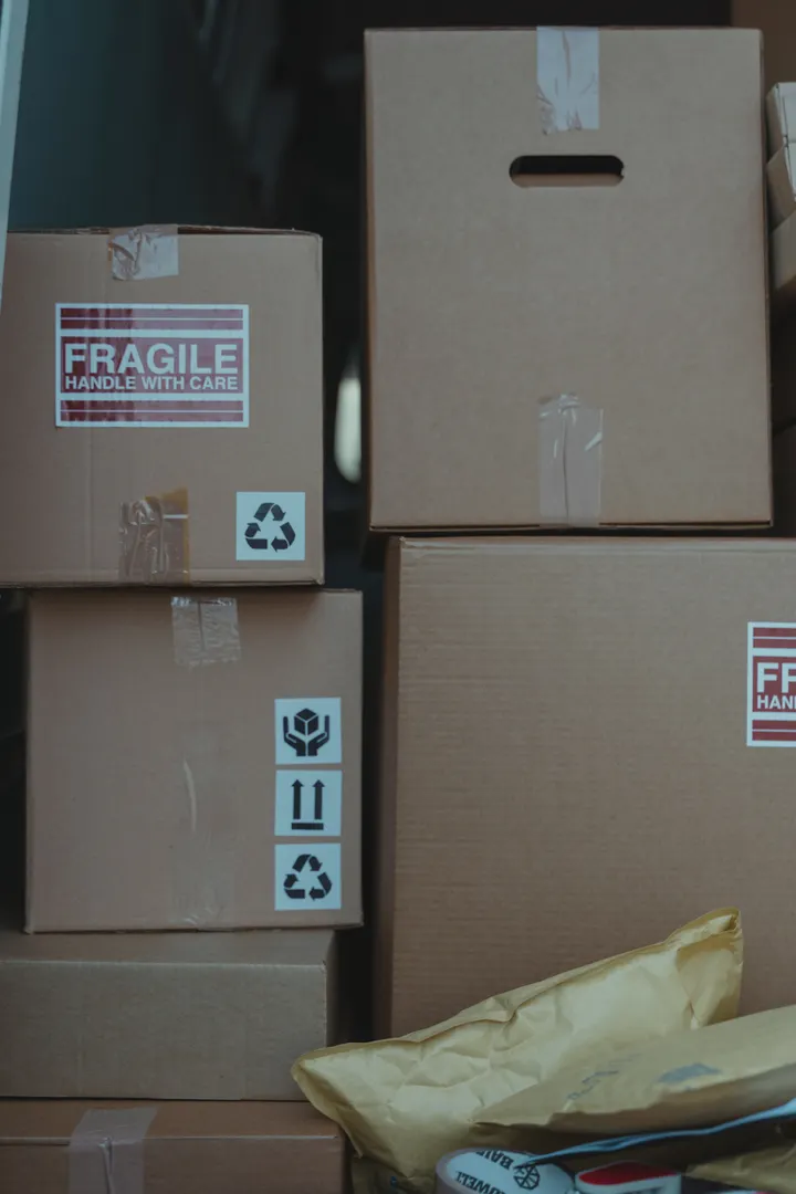 Stacked shipping cartons with handling labels