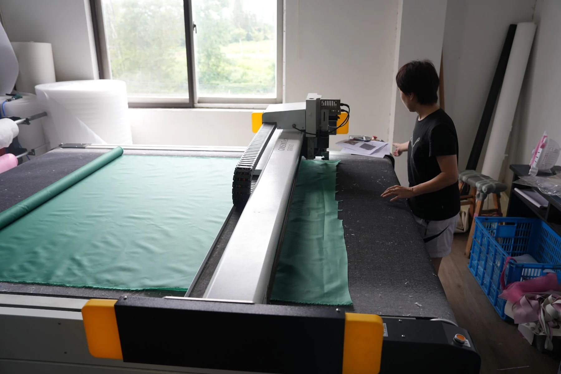 Fabric cutting process using an automated cutting machine